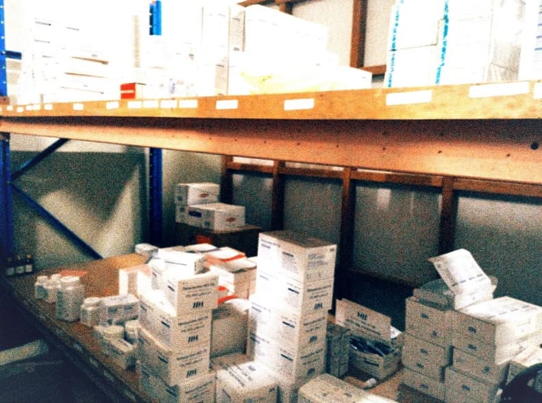 Medicines and supplies stacked on shelves in the stockroom